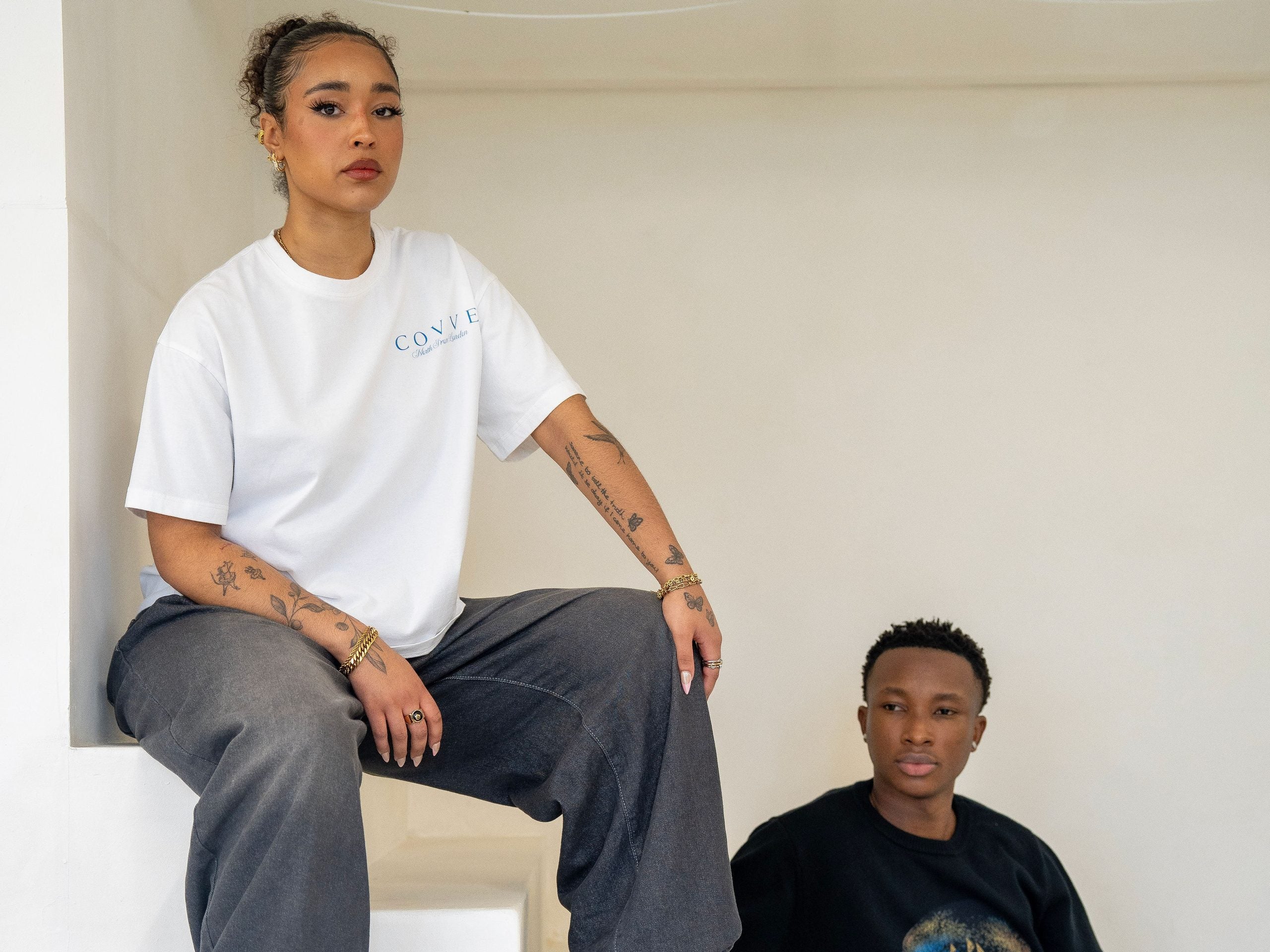 Two COVVE models in North From London pieces on white studio steps