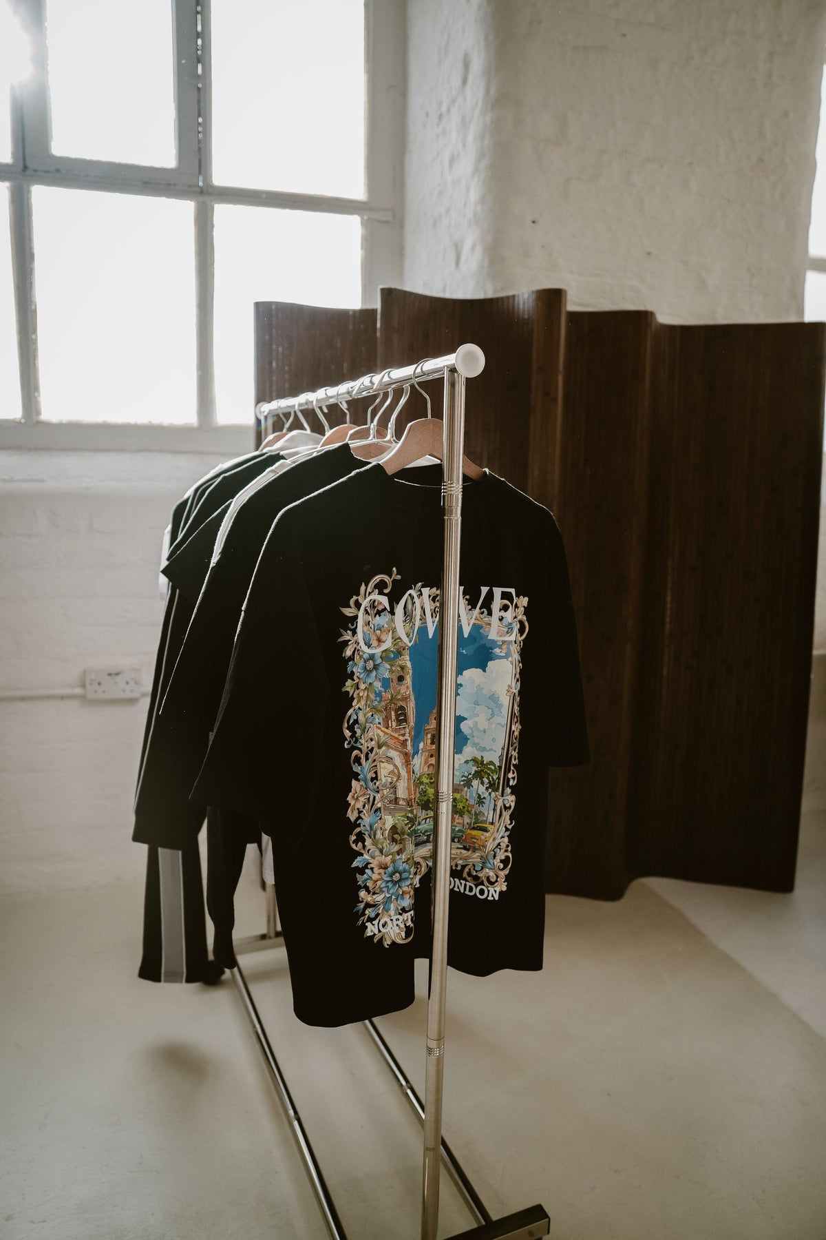 The City Bloom tee on a studio rail beside the North From London collection