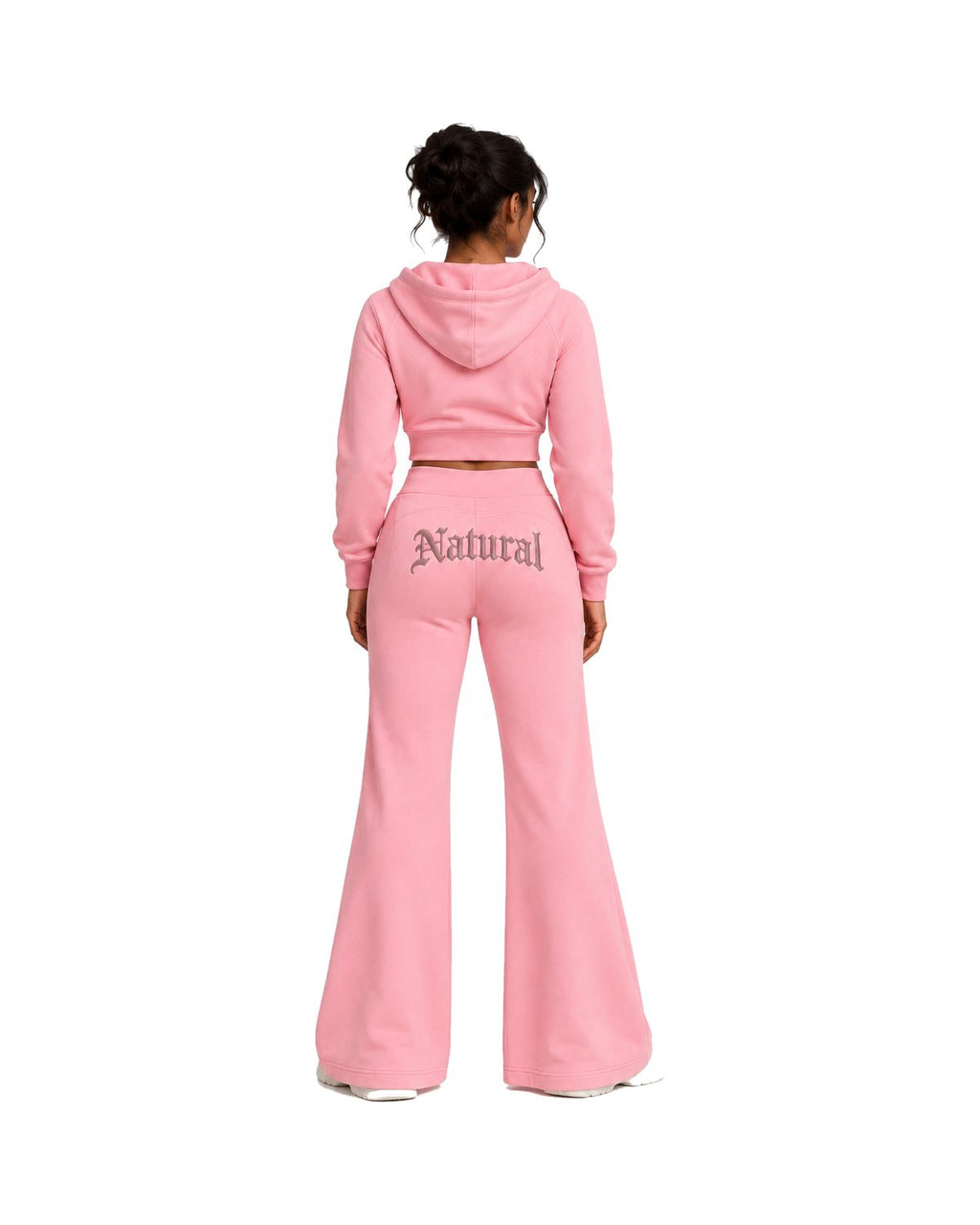 Blush Pink Natural Flow tracksuit worn by a model, back view showing the "Natural" embroidery