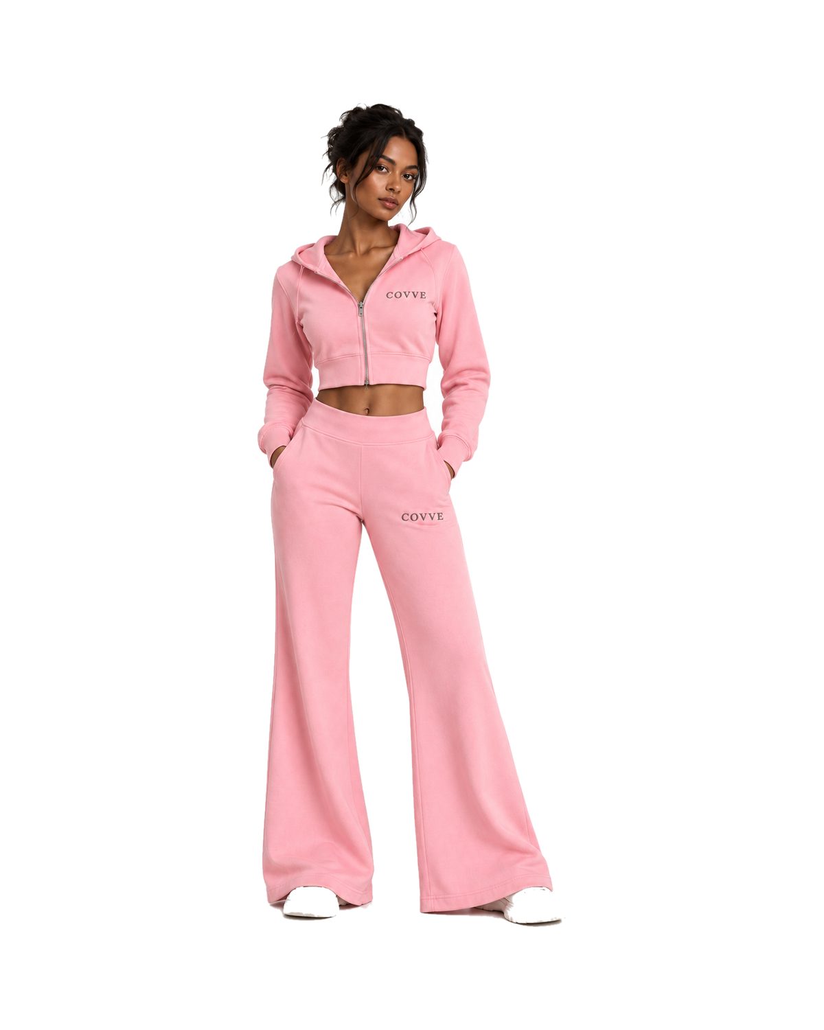 Blush Pink Natural Flow tracksuit worn by a model, front view: cropped zip hoodie and flared track pants