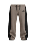 Taupe Stealth Monogram track pants, front view with monogram side panels and the COVVE monogram on the thigh