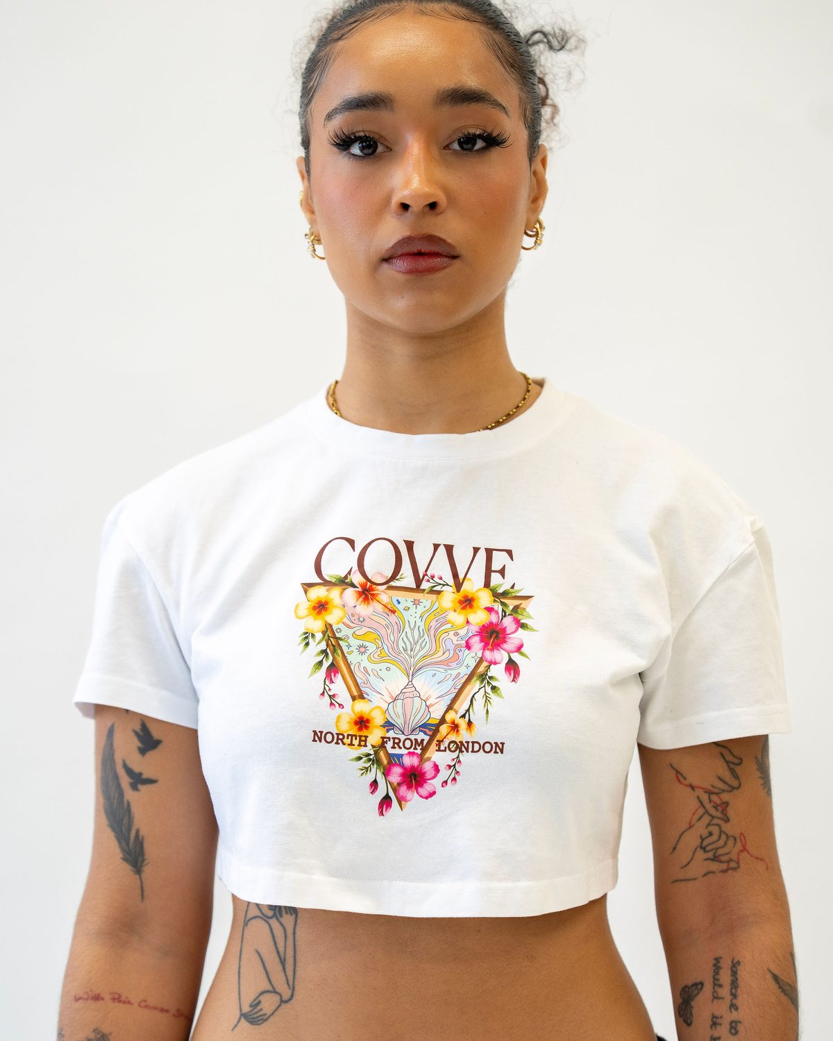 Model wearing the White City Bloom cropped T-shirt, front view